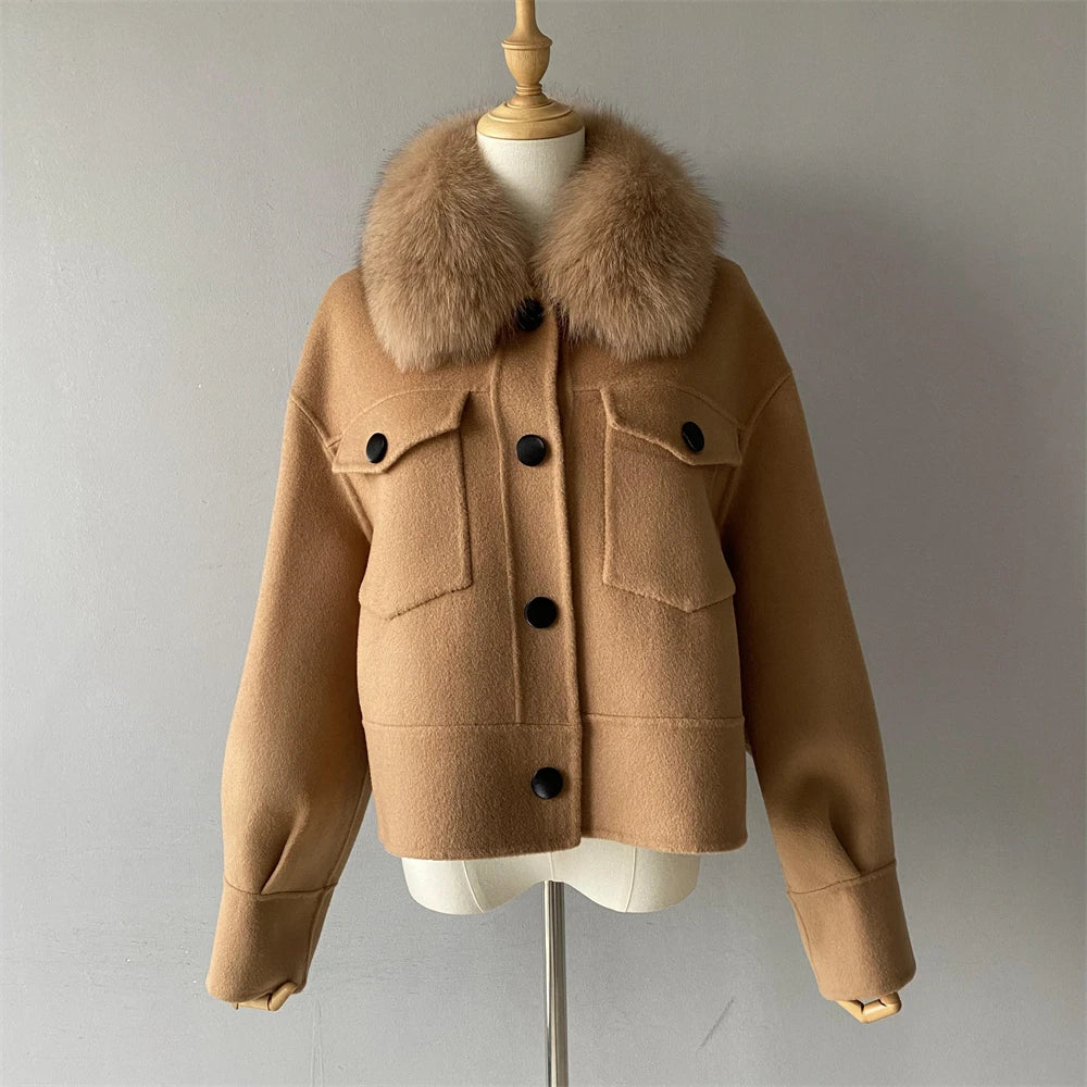 Brown jacket with fur collar on a mannequin against a gray background