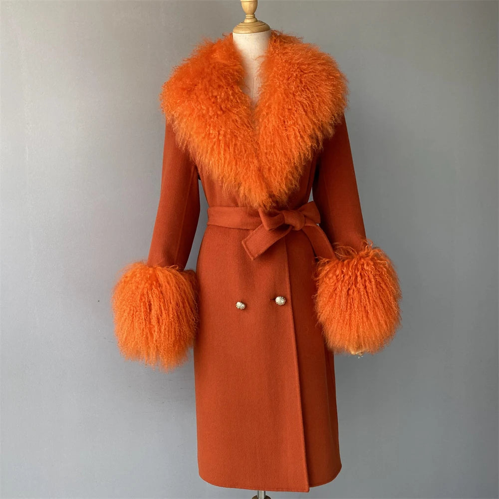 Orange coat with fur trim on a mannequin against a gray background