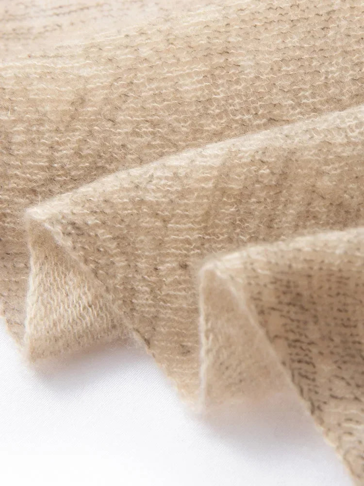 Close-up of beige fabric texture on a white background