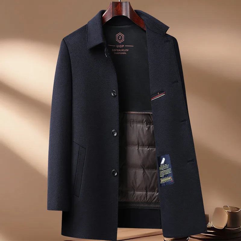 Navy blue coat with a brand label on a beige background