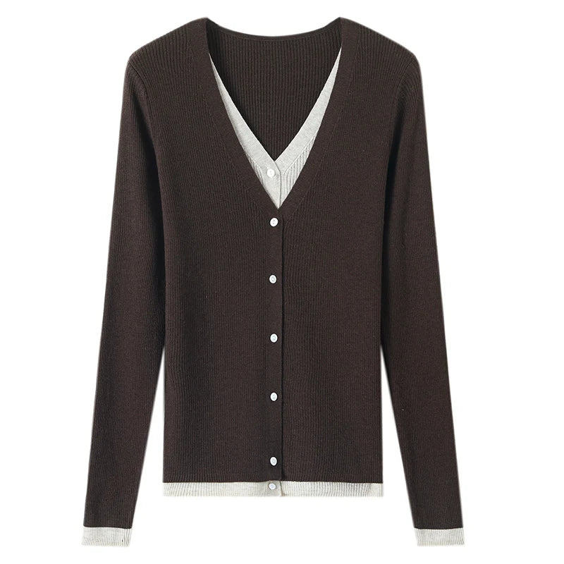Brown cardigan with white trim on a white background