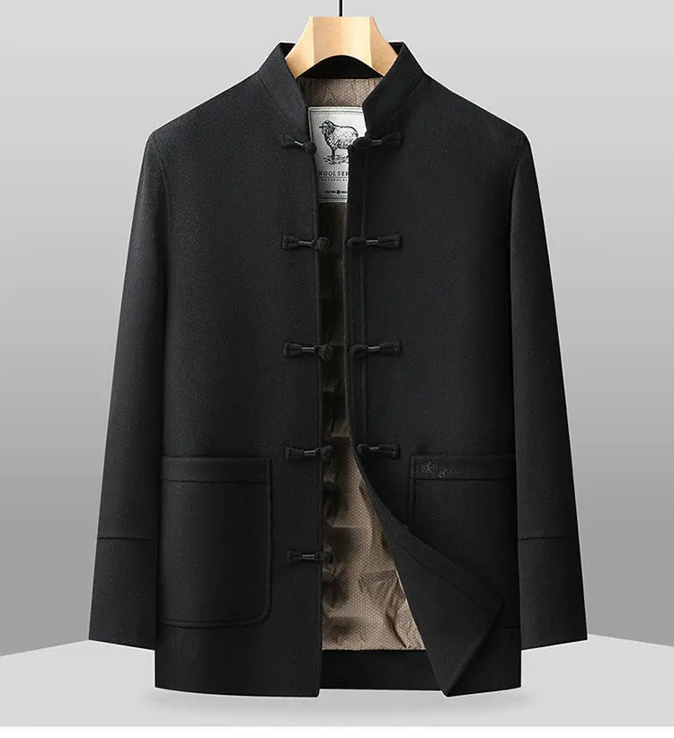Black traditional-style jacket on a gray background