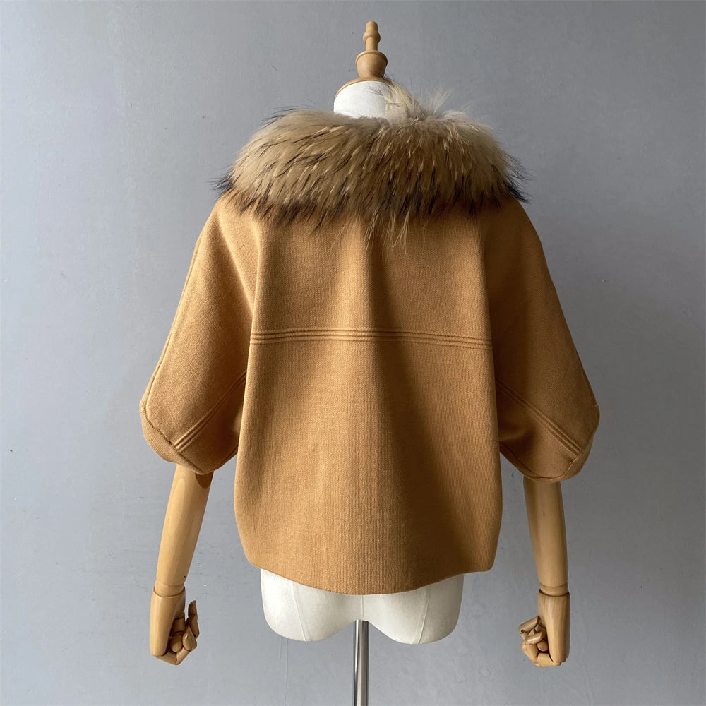 Brown coat with fur collar on a mannequin against a gray background