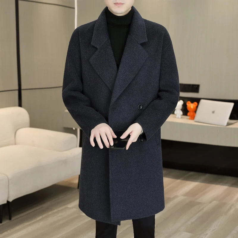 Person wearing a dark blue coat in an indoor setting