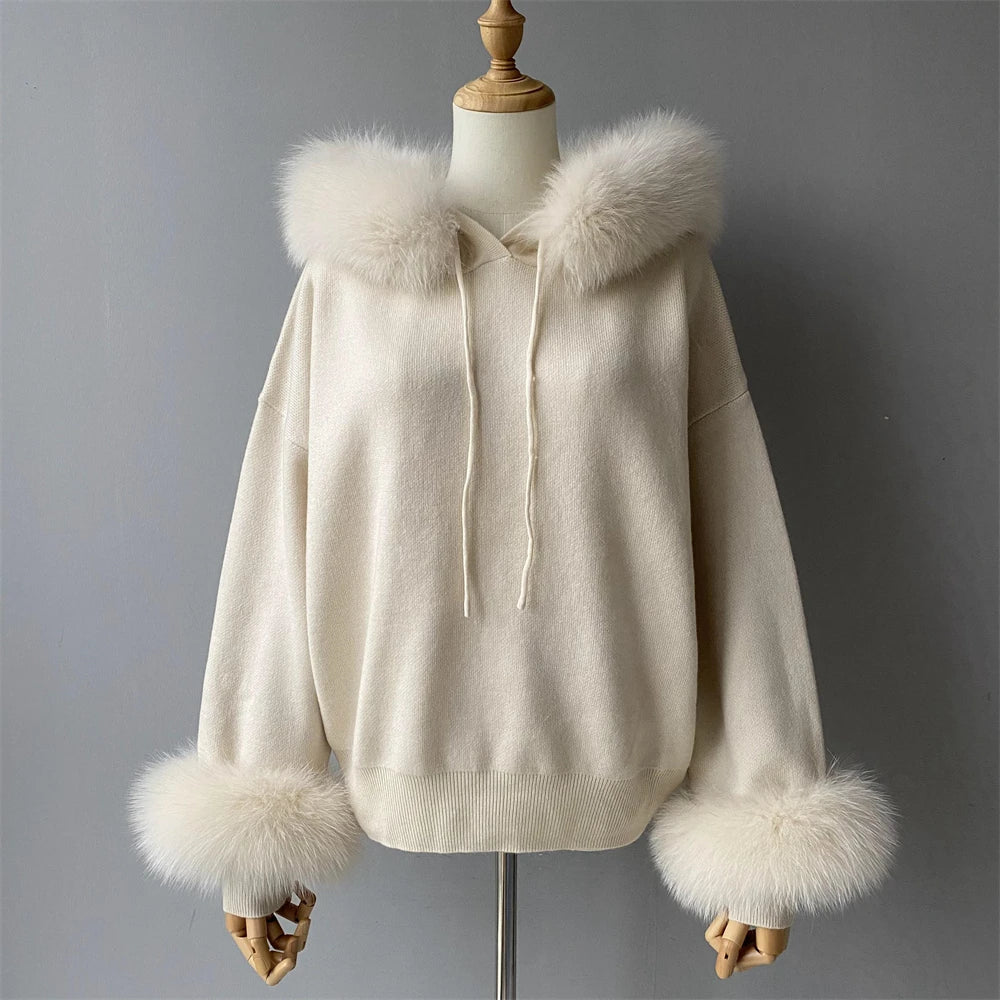 White hoodie with fur trim on a mannequin against a gray background