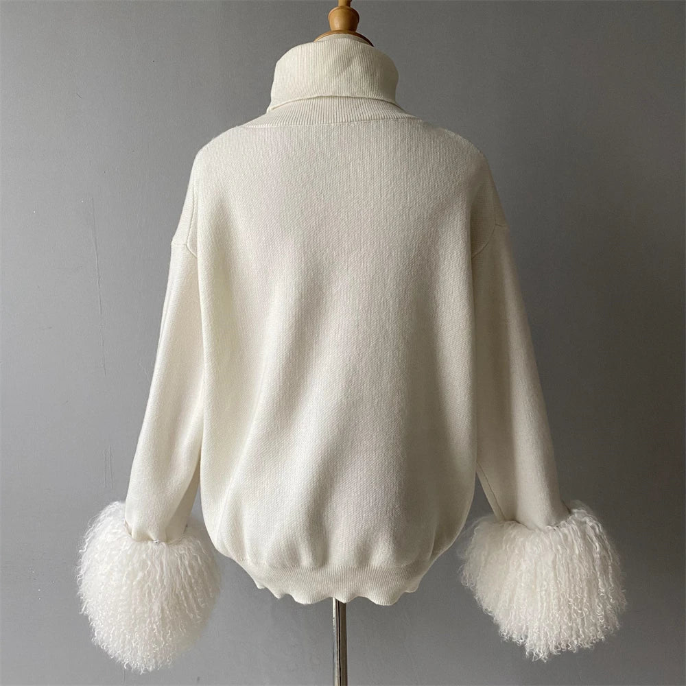 White sweater with fluffy cuffs on a mannequin against a gray background