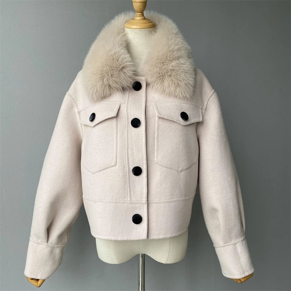 Beige jacket with fur collar on a mannequin against a gray background