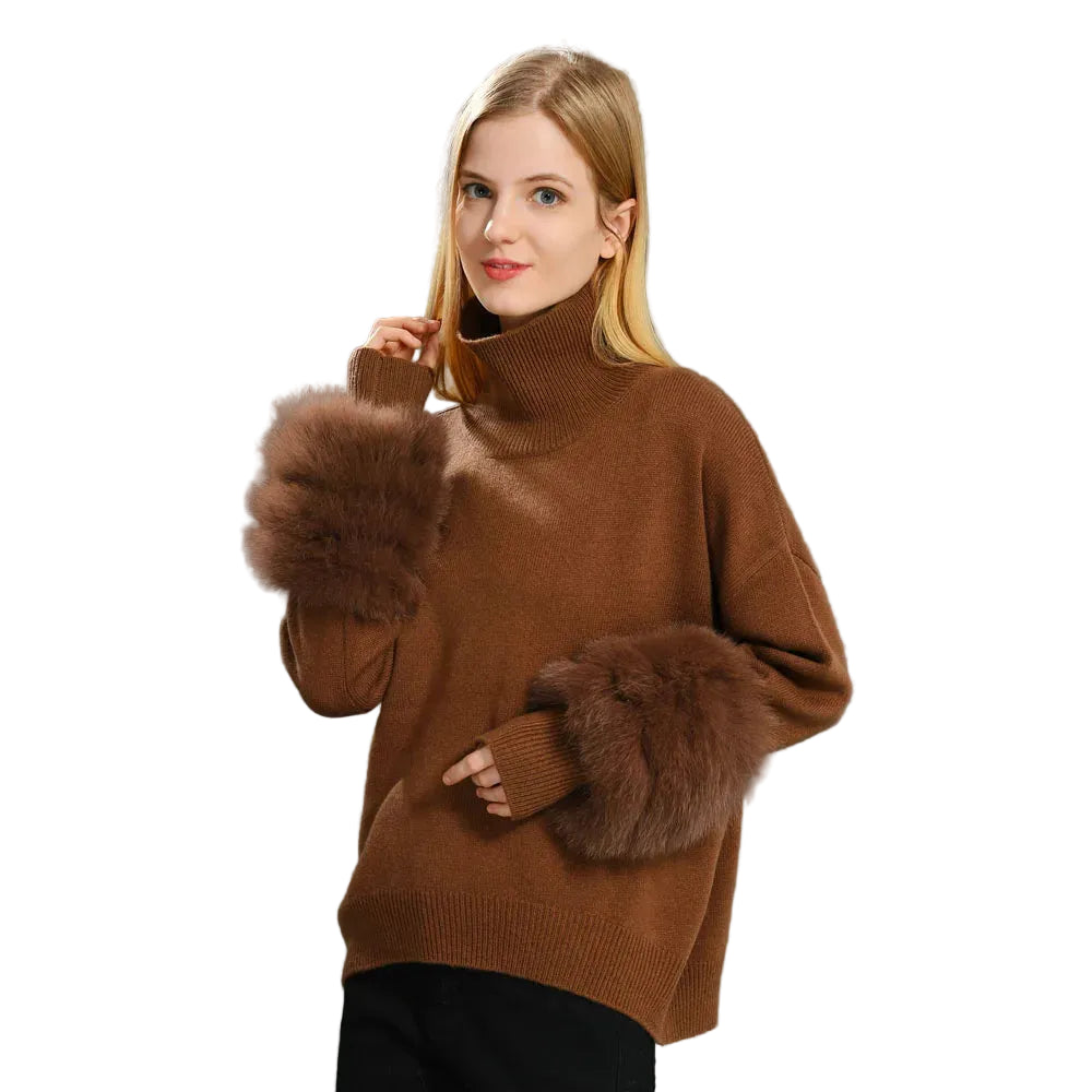 Woman wearing a brown sweater with fur cuffs on a gray background
