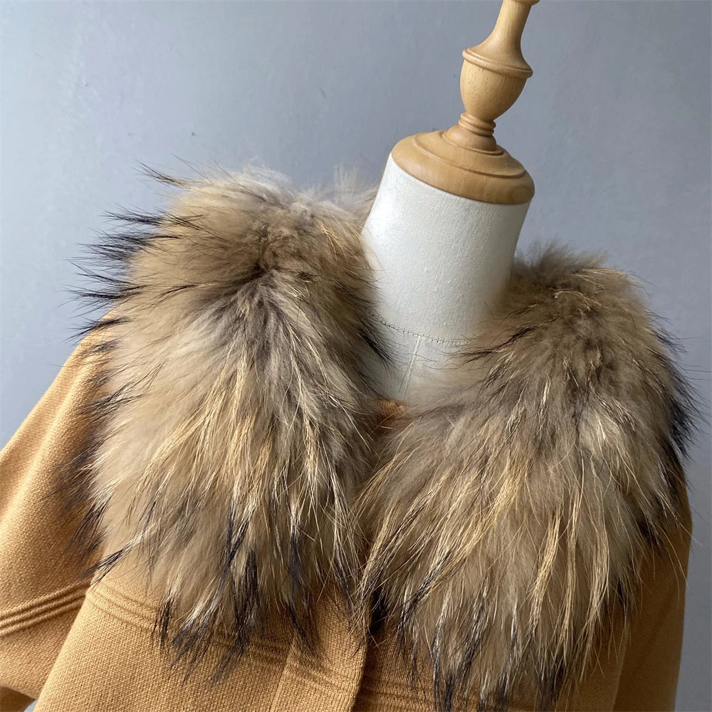 Brown coat with fur collar on a mannequin against a gray background