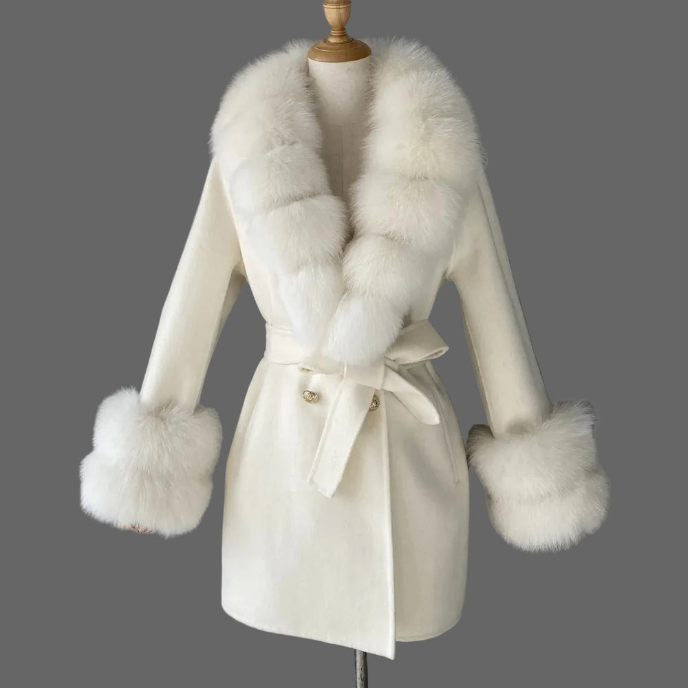 White coat with fur trim on a mannequin against a gray background