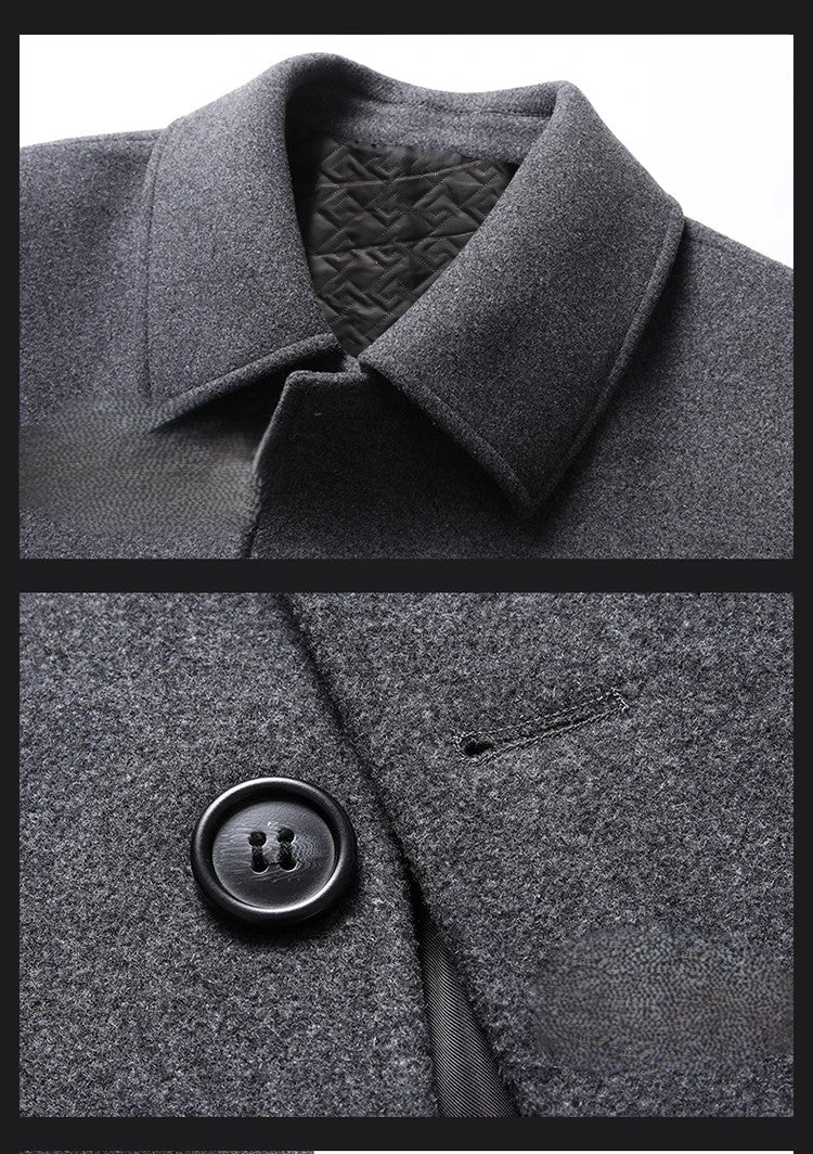 Close-up of a gray coat with a collar and button detail.