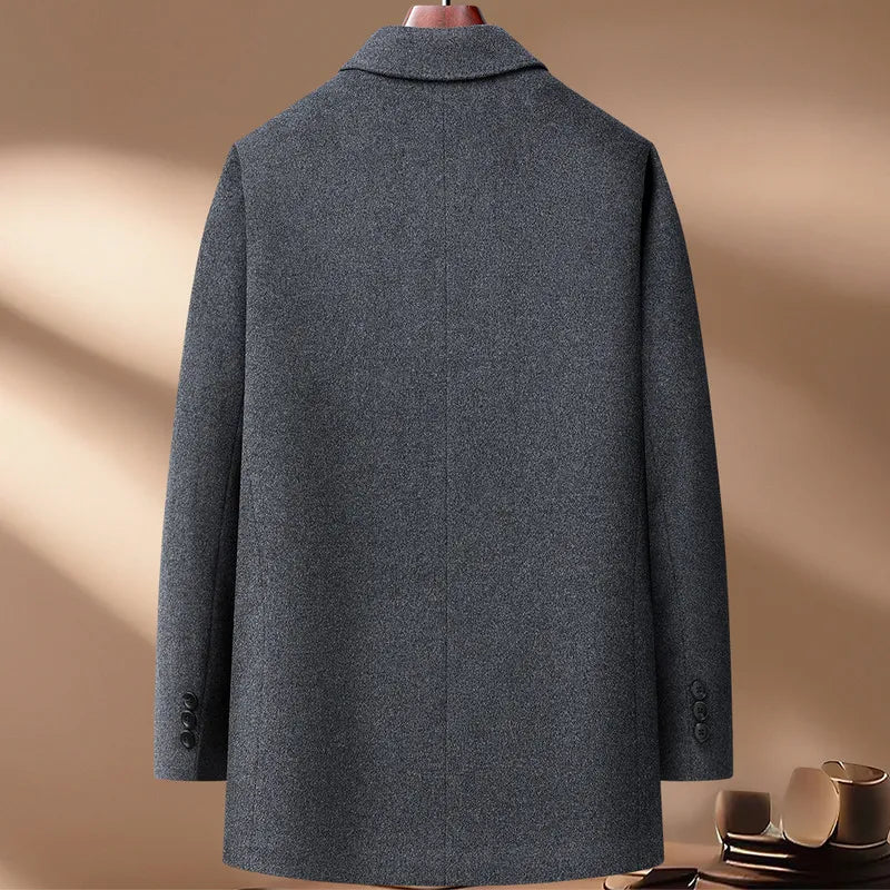 Gray coat on a mannequin against a beige background
