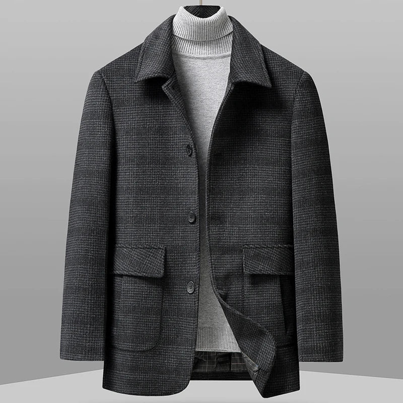 Gray checkered coat on a mannequin against a gray background