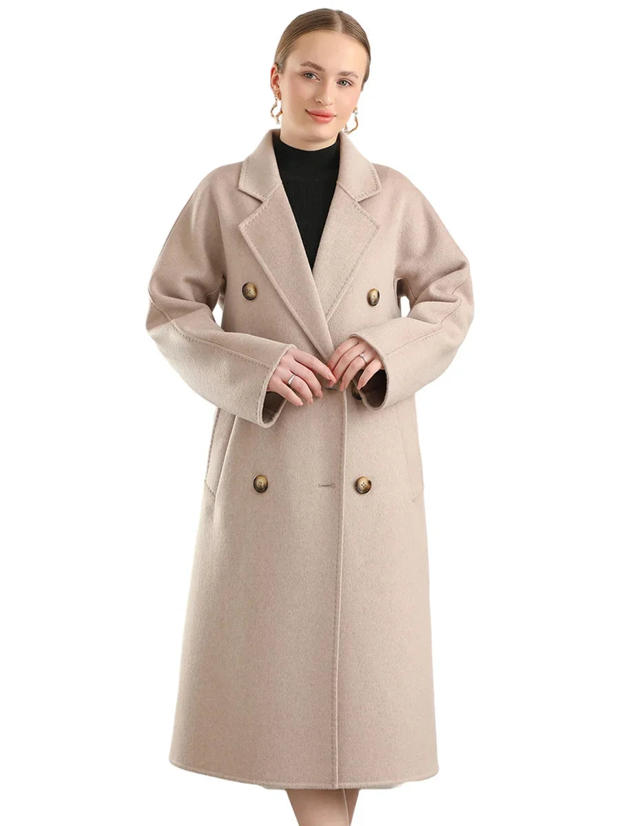 Woman wearing a beige coat with gold buttons on a white background