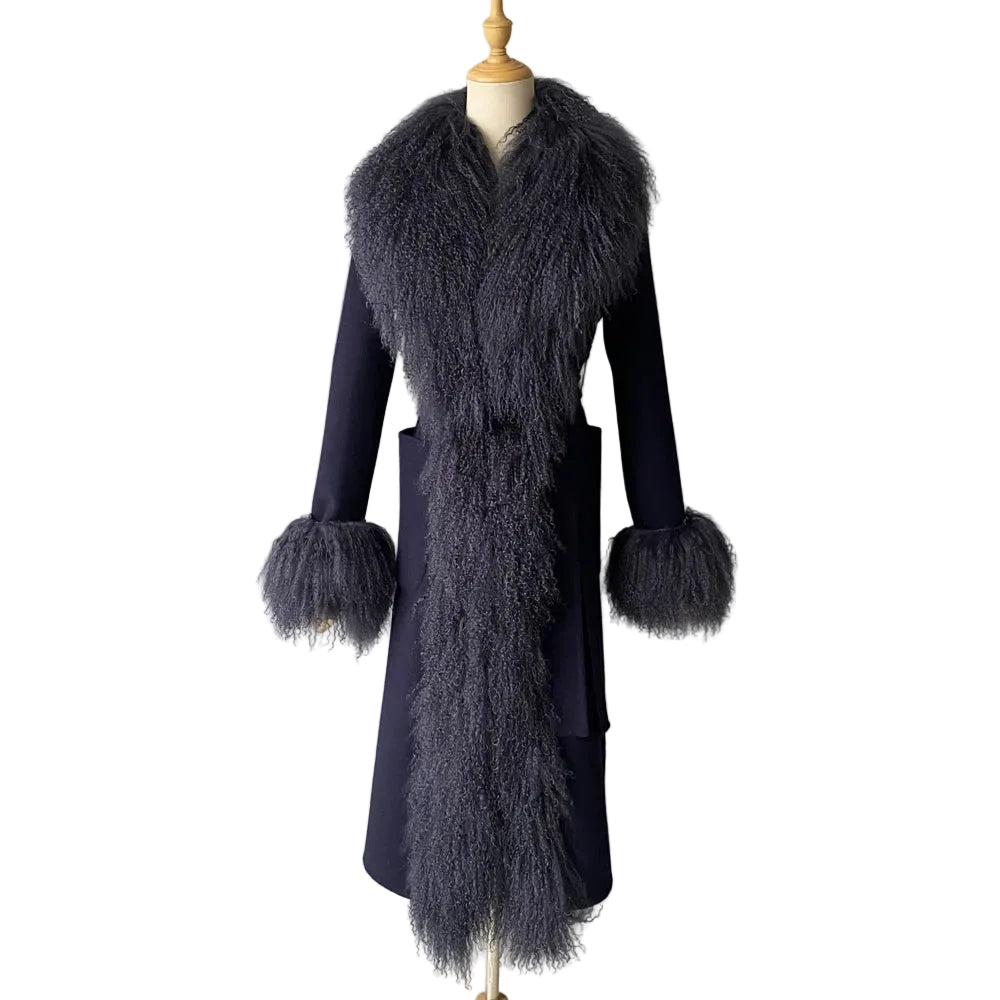 Navy blue coat with fur details on a mannequin against a plain background