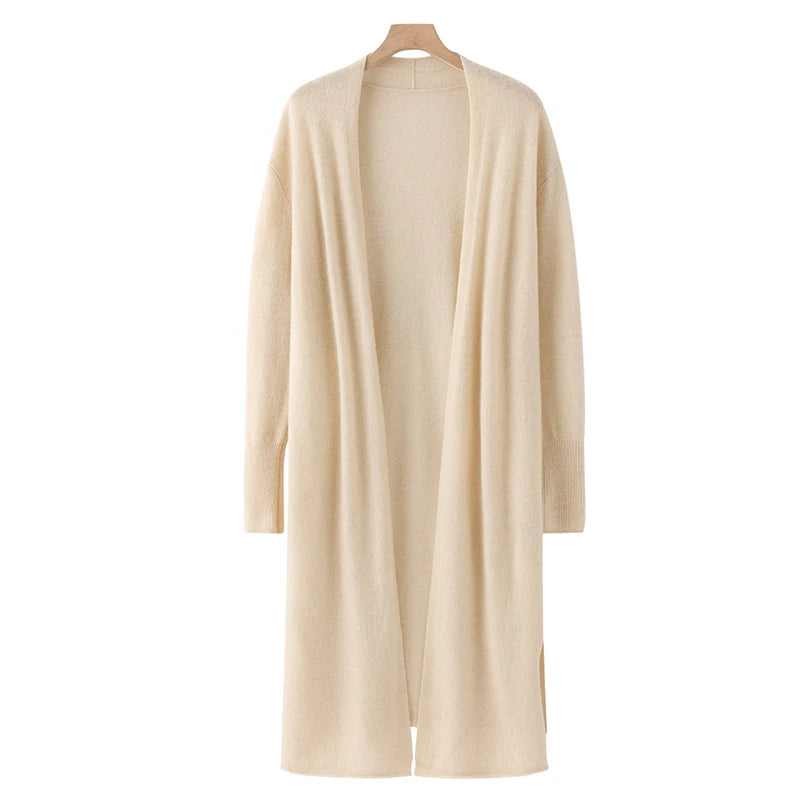 Beige cardigan on a hanger against a white background