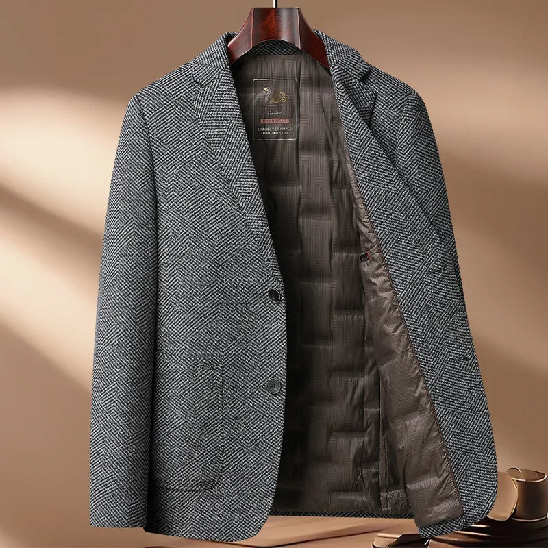 Gray herringbone blazer with quilted lining on a wooden stand against a beige background