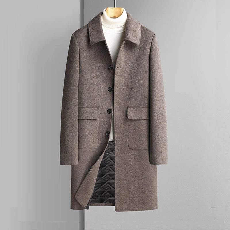 Brown coat on a mannequin against a gray background