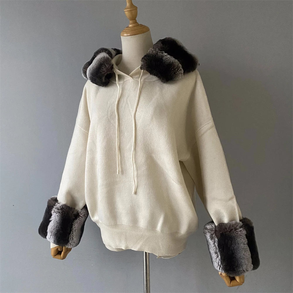 White hoodie with fur trim on a mannequin against a gray background