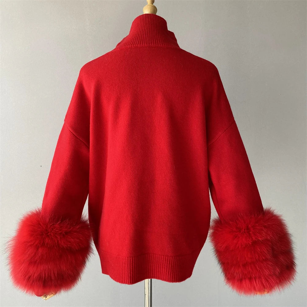Red sweater with fur cuffs on a mannequin against a plain background