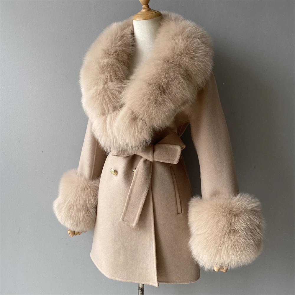 Beige coat with fur collar and cuffs on a mannequin against a gray background