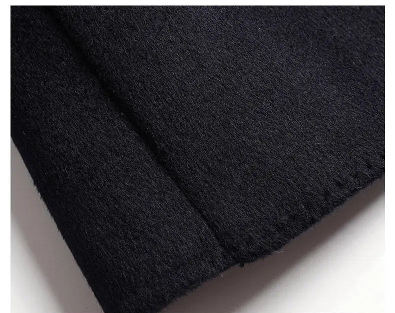 Close-up of black fabric with a textured surface on a white background