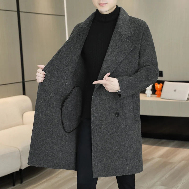 Person wearing a gray coat in an indoor setting