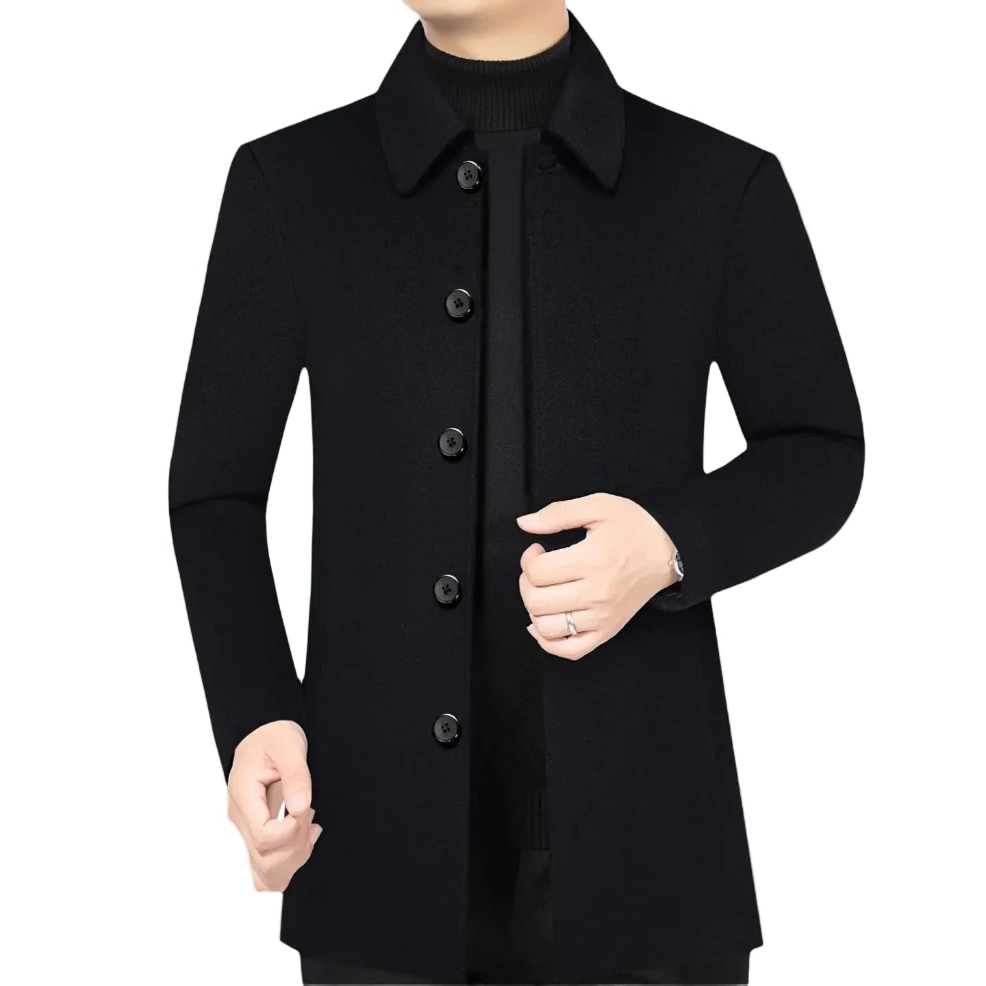 Person wearing a black coat with a plant in the background