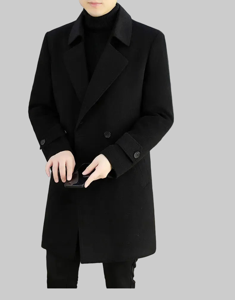 Person wearing a black coat in an indoor setting