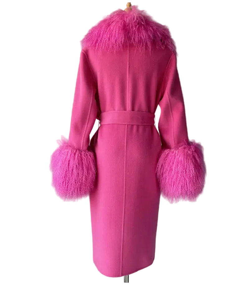 Pink coat with feathered cuffs and collar on a mannequin against a plain background