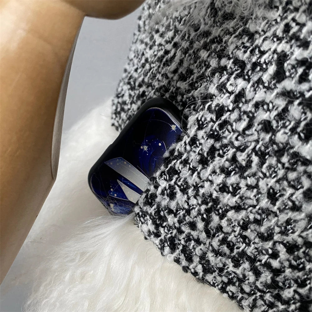Close-up of a phone case with a textured surface and blue accents.