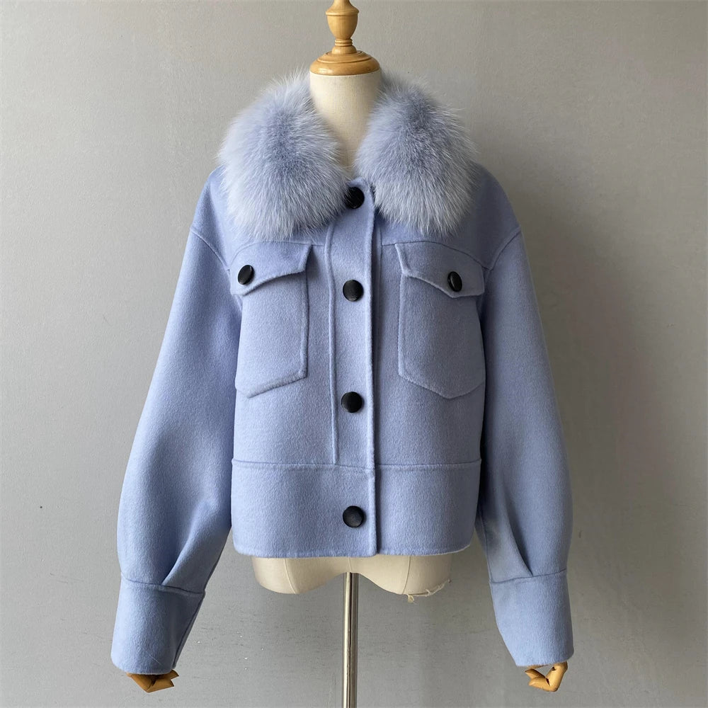 Light blue jacket with fur collar on a mannequin against a plain background