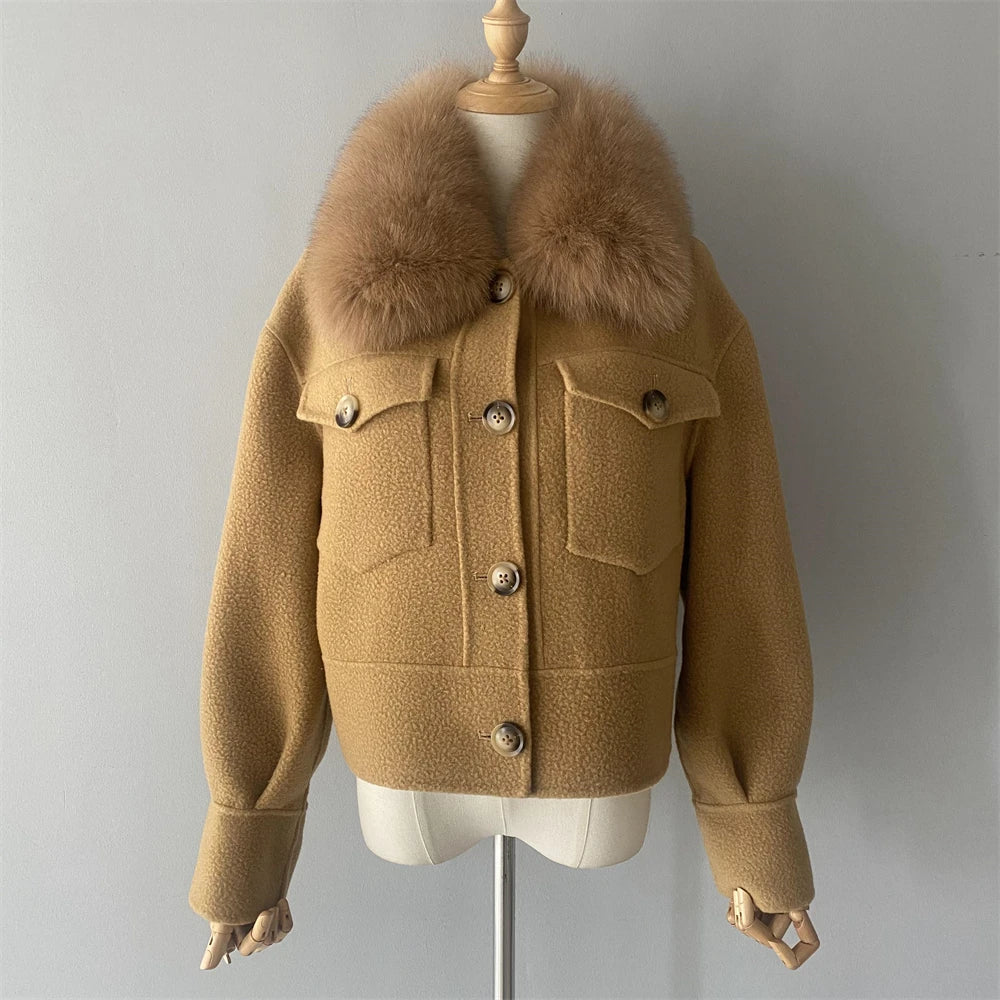 Brown jacket with fur collar on a mannequin against a gray background