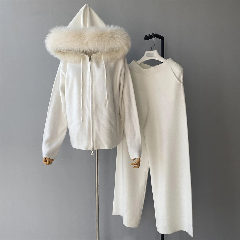 White hooded jacket with fur trim on a gray background
