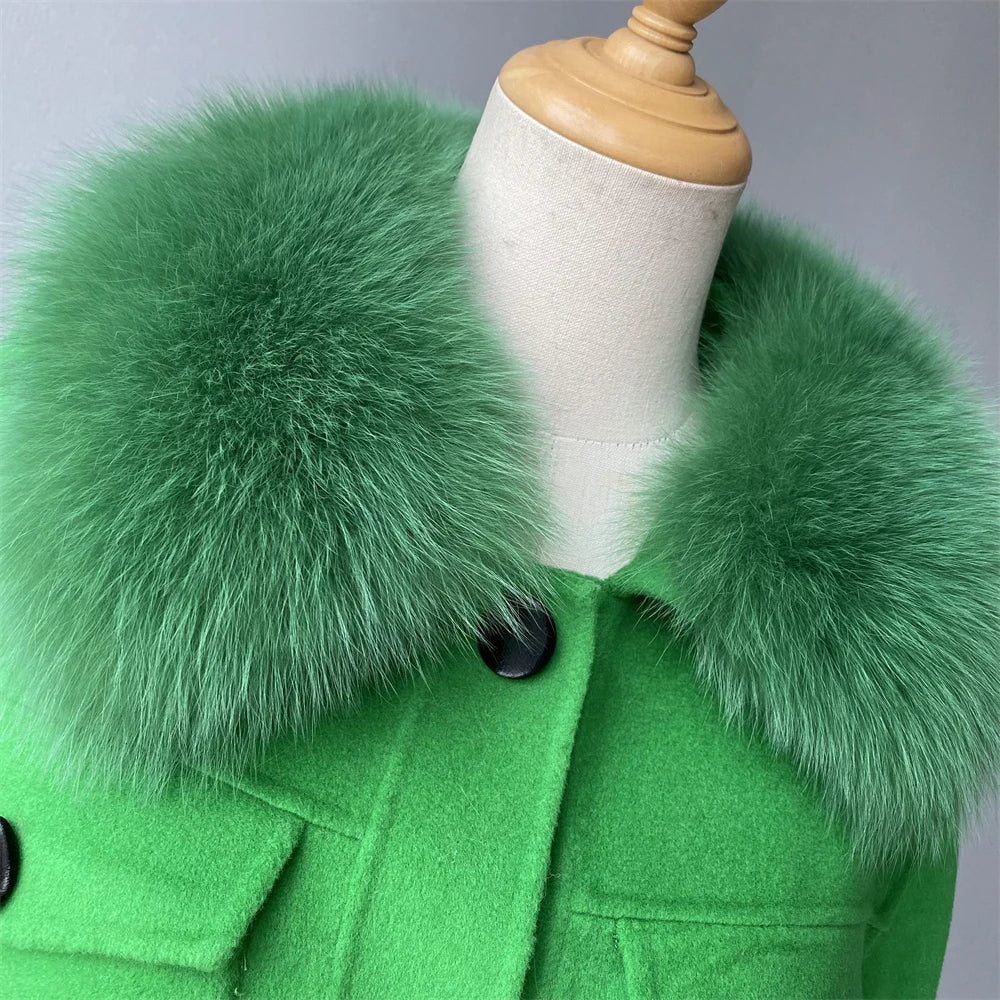 Green coat with a fur collar on a mannequin against a gray background