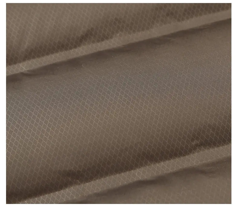 Close-up of brown fabric with a subtle pattern on a white background