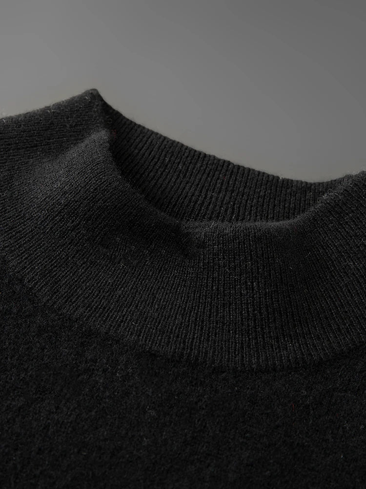 Close-up of a dark gray knit sweater collar on a matching background