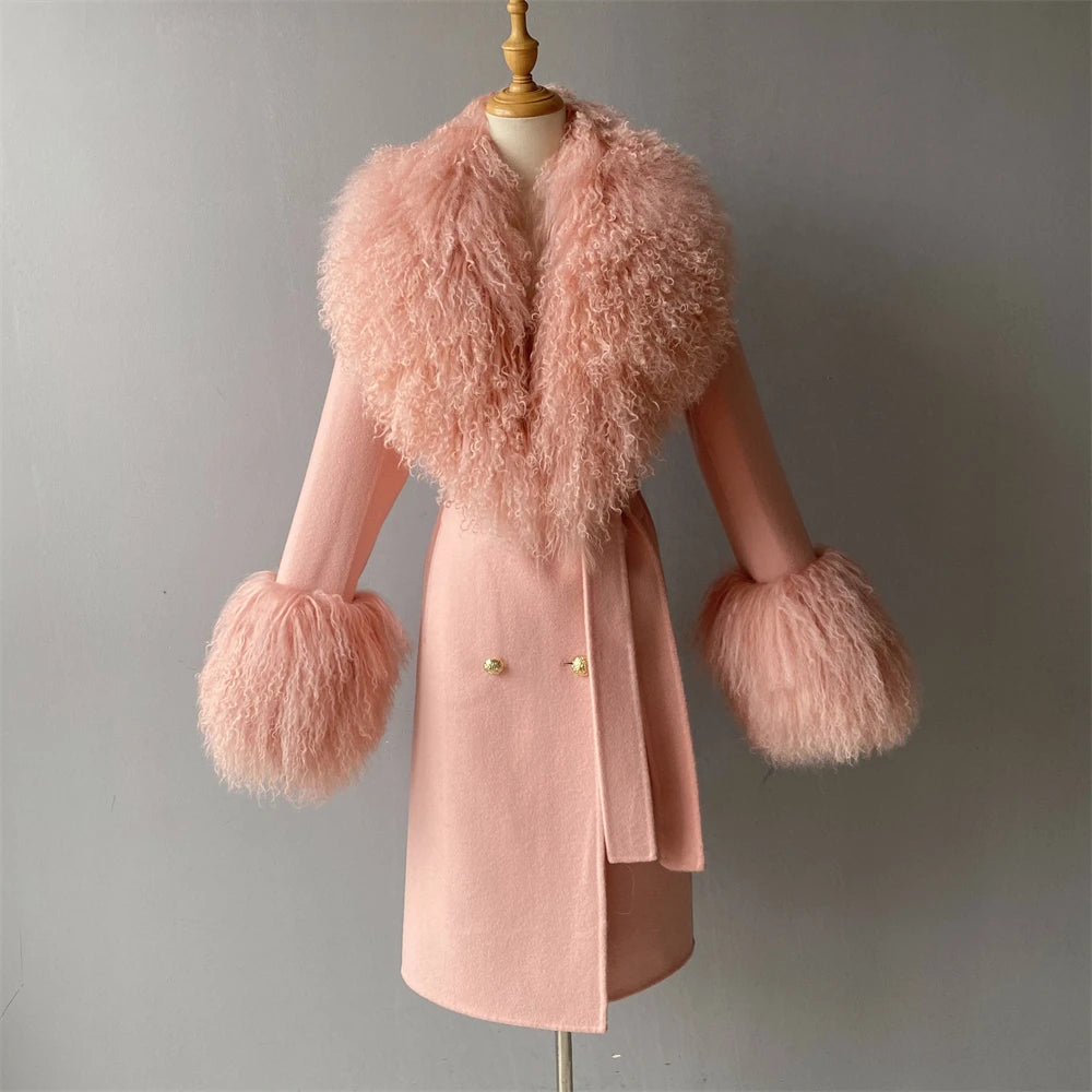 Pink coat with fluffy sleeves and collar on a mannequin against a gray background
