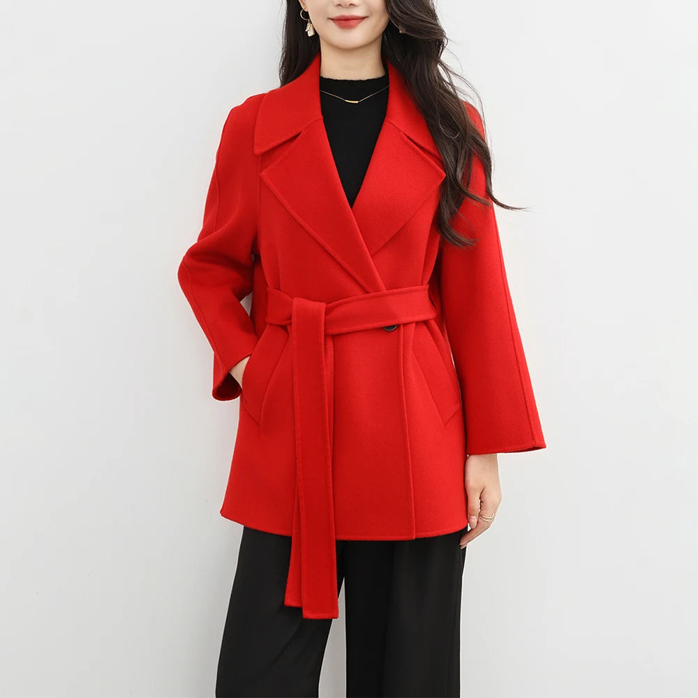 Red coat worn by a person on a white background