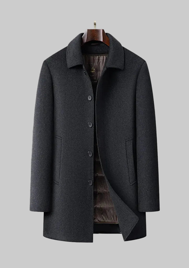 Gray coat on a mannequin against a gray background