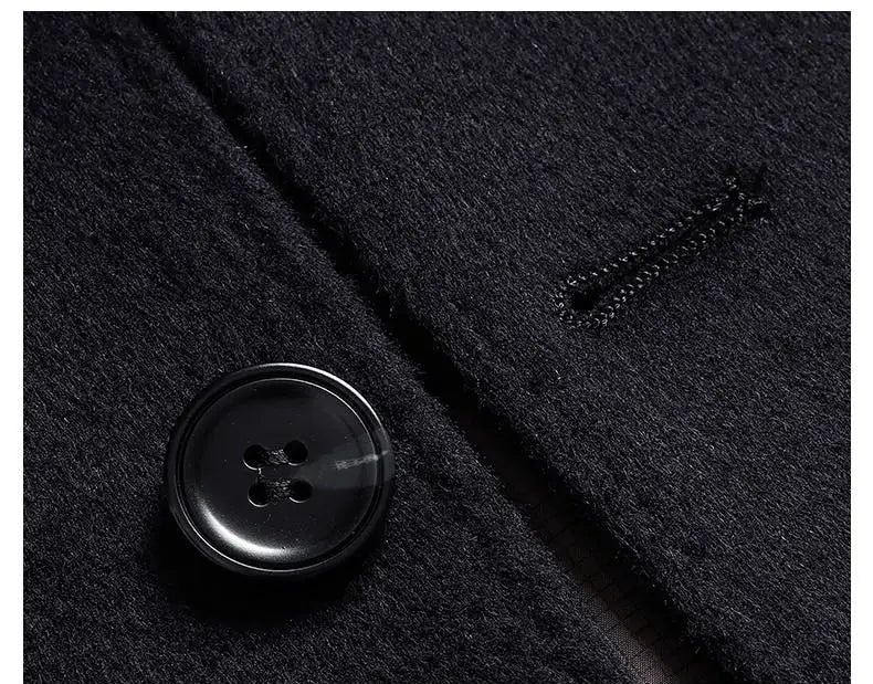 Close-up of a black button on a dark fabric texture with Chinese text.
