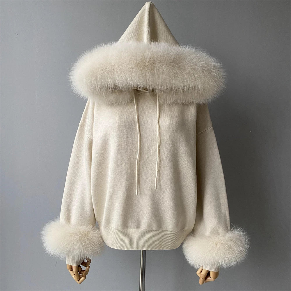 White hoodie with fur trim on a gray background