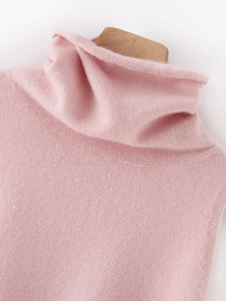 Close-up of a pink turtleneck sweater on a mannequin against a white background