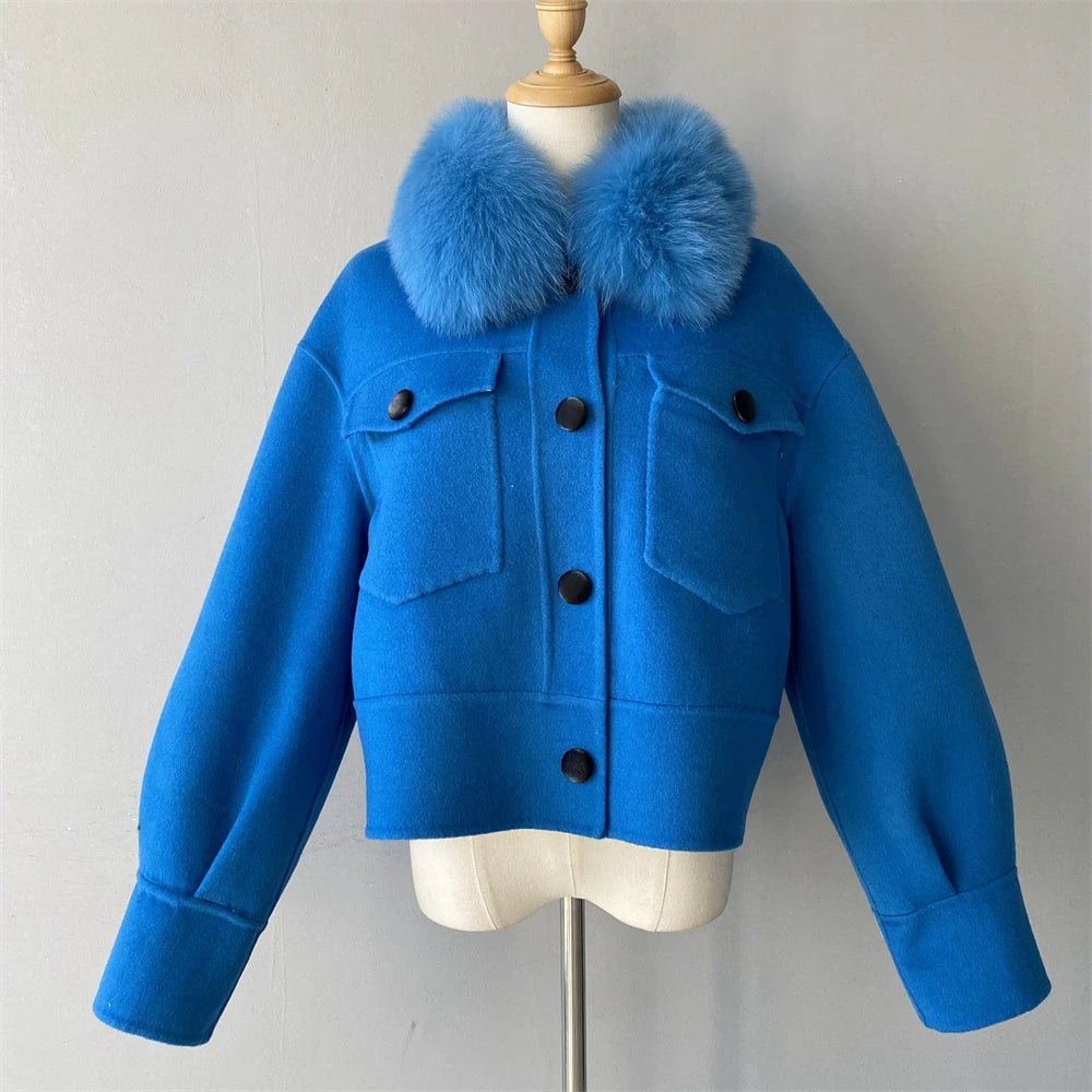 Blue jacket with fur collar on a mannequin against a plain background