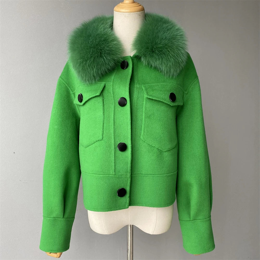 Green jacket with fur collar on a mannequin against a gray background