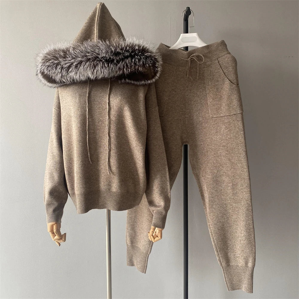 Brown hoodie with fur-lined hood and matching pants on a gray background