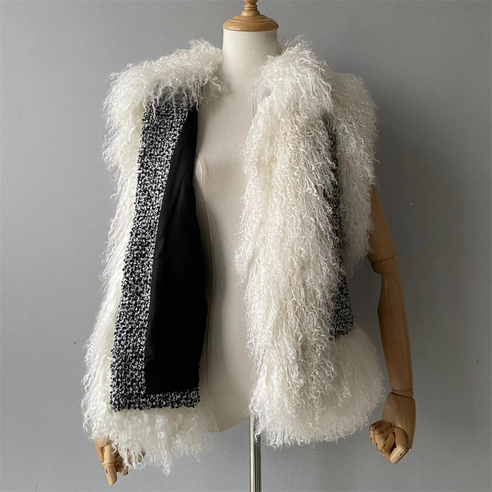 Mannequin wearing a white fluffy vest with a textured black inner lining on a gray background