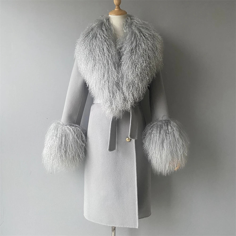 Gray coat with feathered cuffs and collar on a mannequin against a gray background