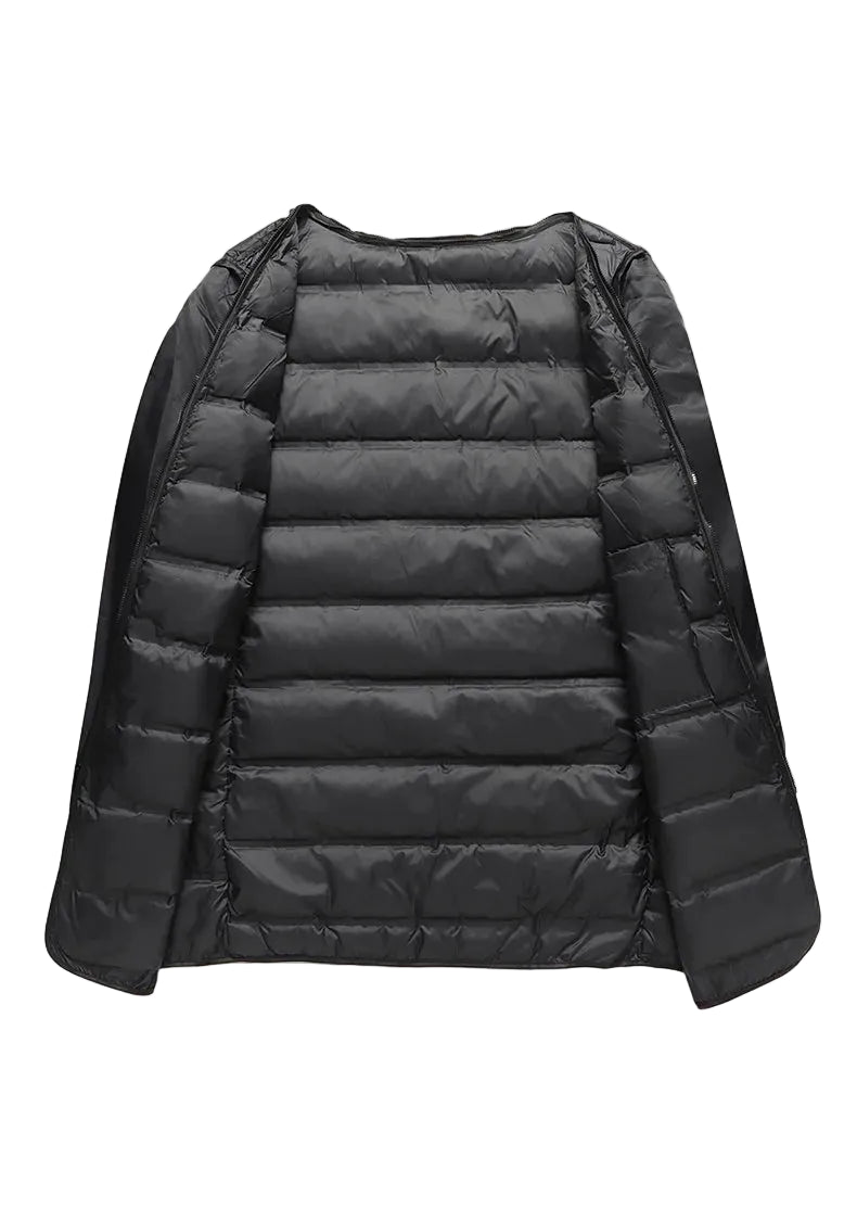 Black puffer jacket on a beige background