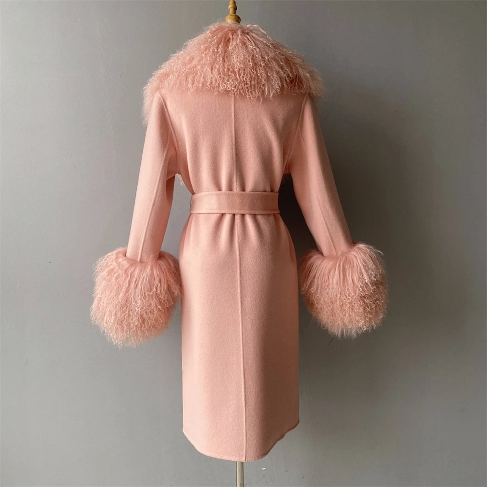 Pink coat with fur trim on a mannequin against a gray background